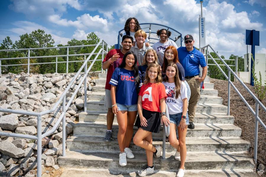 A group of students stand outside the USCA Convocation Center (File)