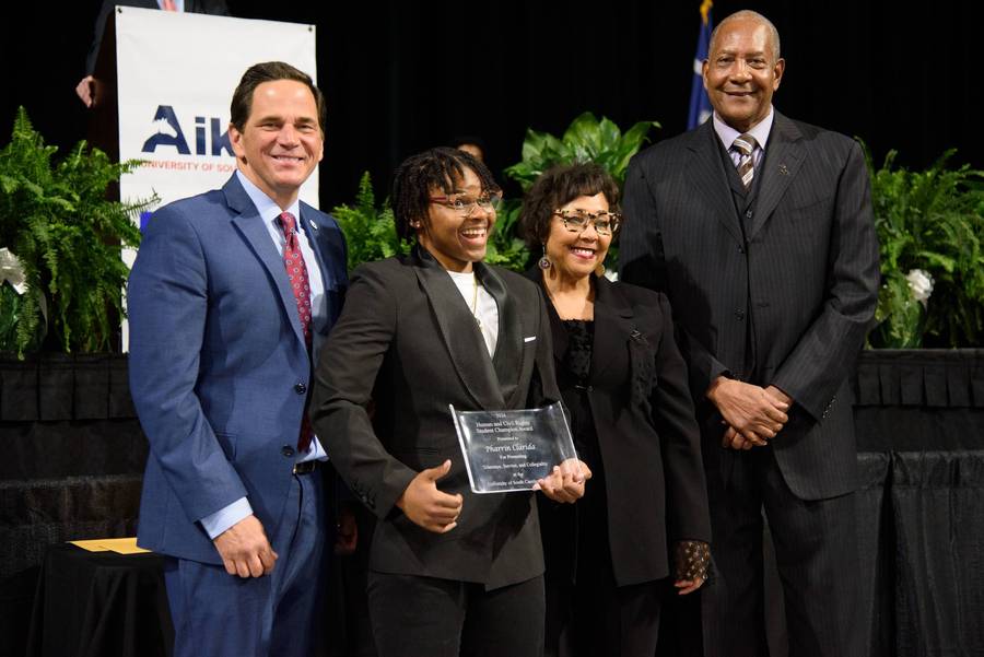 Pharrin Clarida, 2024 Human and Civil Rights Champion Award Recipient, stands alongside Dr. Daniel J. Heimmermann (Left), Gail Diggs, Aiken City County Member, and Alex English, retired NBA Player.