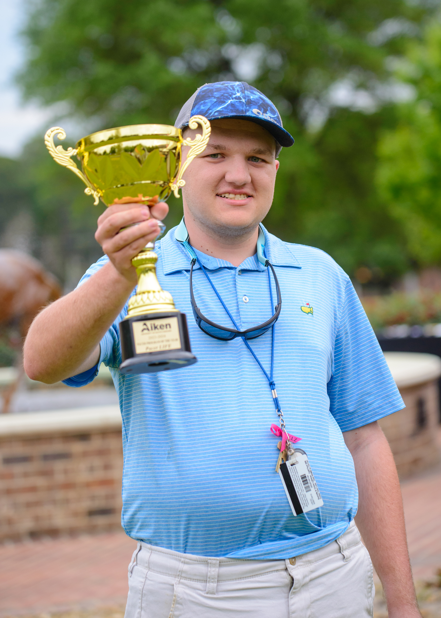 USCA LIFE Photo of student with recognition trophy